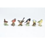 A collection of Beswick birds to include a Wren, Chaffinch, Whitethroat, stone chat, blue tit ands a
