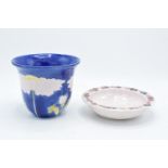 Lise B Moorcroft pottery to include a blue daisy vase and a shallow bowl decorated with grapes (