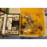 A collection of costume jewellery to include a portable jewellery box with a mirror backed lid.