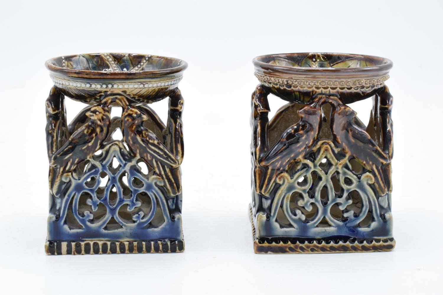 A near pair of Doulton Lambeth table salts with a bird design, circa 1876 with marks to base. In