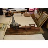 A mid to late 20th century Black and Decker portable lathe mounted on a wooden base. Untested,