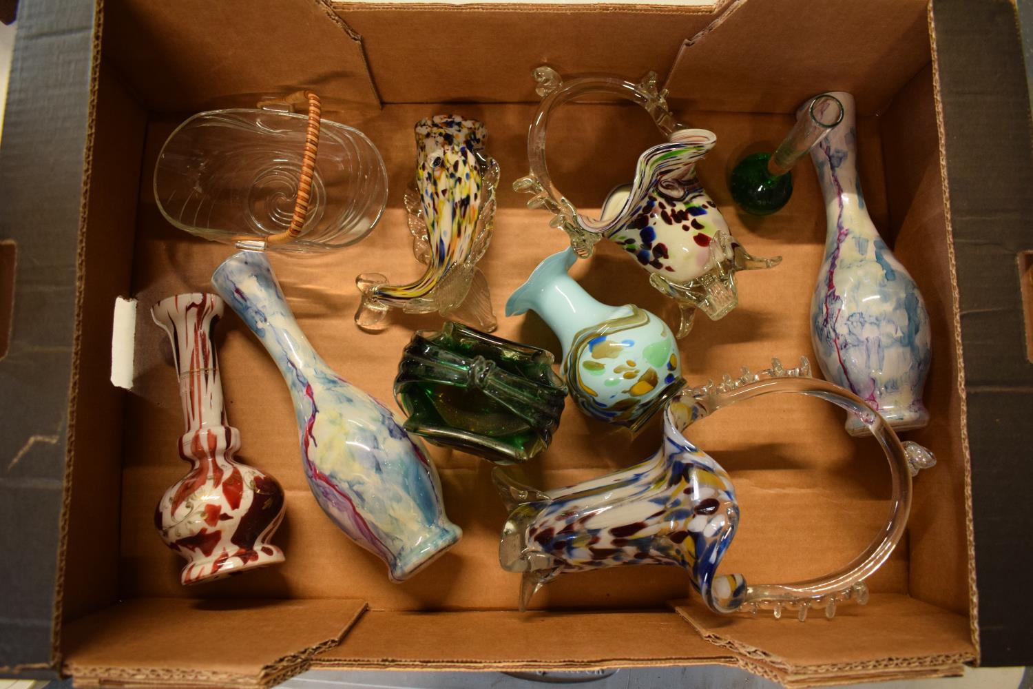 A mixed collection of glassware to include Murano-style items such as fish, baskets, vases etc. No