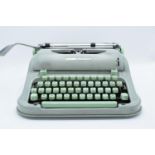 Hermes Media 3 typewriter in case. Untested. Assumed spares/repairs. Some paint loss to the exterior