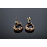 A pair of 9ct gold earrings in an oval shape. 2.1 grams. Full hallmarks to interior.