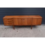 A.H. Mcintosh Of Kirkcaldy retro 1960s teak sideboard raised on tapered legs. Approx 208 x 46 x