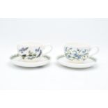 A pair of Portmeirion breakfast cups and saucers in the Botanic garden design (both seconds). In