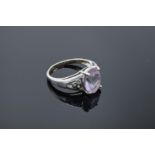 9ct white gold ladies ring set with a pink stone. Gross weight 4.1 grams. Size R.