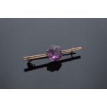9ct gold ladies brooch set with an amethyst stone with a base metal pin. 4.6 grams gross weight.