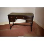 Wooden 20th century priory style desk/ sideboard with a leather insert. In good condition with age