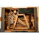 A mixed collection of antique and vintage wooden items to include a trouser press, tools, chopping