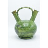 A 19th century decorative earthenware vase with double spout and bridge style handle. In good