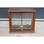 A early-mid 20 century wooden cased set of laboratory scales made WBN of Glasgow. Sold as decorative