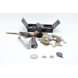 A mixed collection of items to include a hallmarked silver badge, 3 silver coins, a collection of