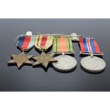 A group of World War Two medals set on a bar to include the 1939-1945 Star, The Africa Star, The