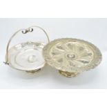 An ornate silver plate tazza/ cake stand together with a silver plate basket/ serving tray (2). 29cm