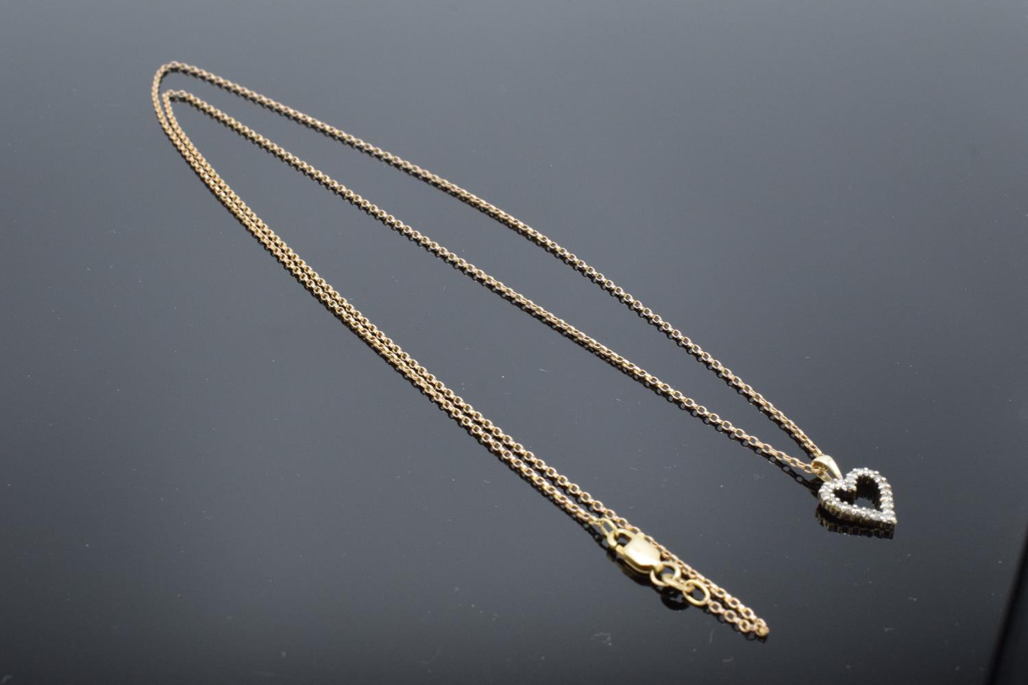 A 9ct gold chain together with a 9ct gold heart-shaped pendant with semi-precious stones, gross - Image 4 of 7