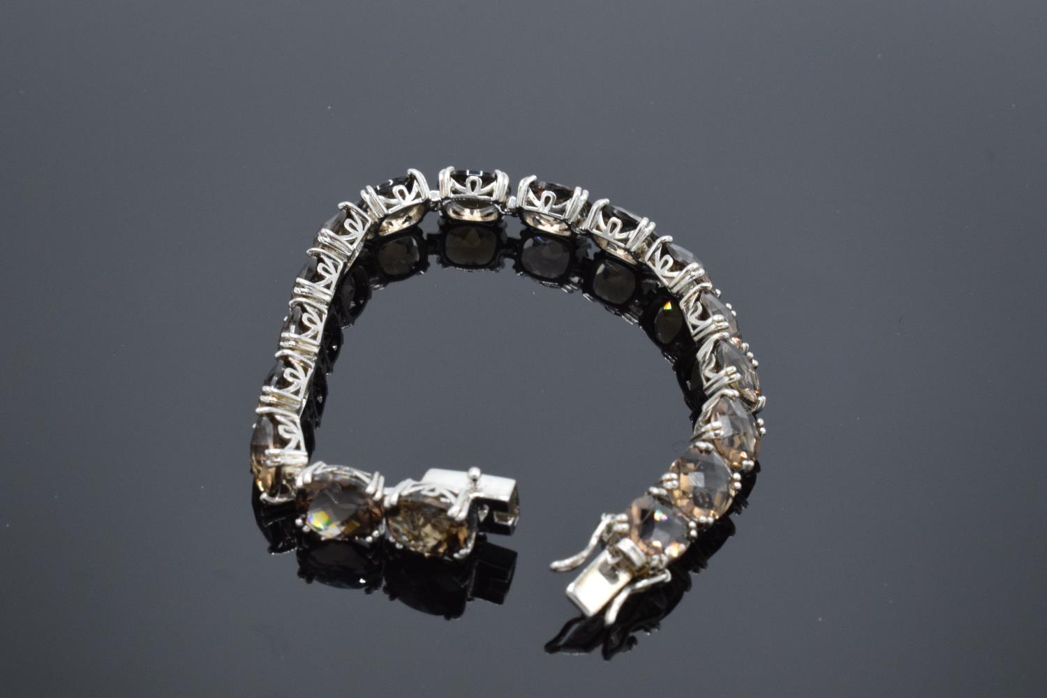 A silver ladies bracelet set with smoky quartz stones, 19.5cm in length. Hallmarked 925 for - Image 3 of 4