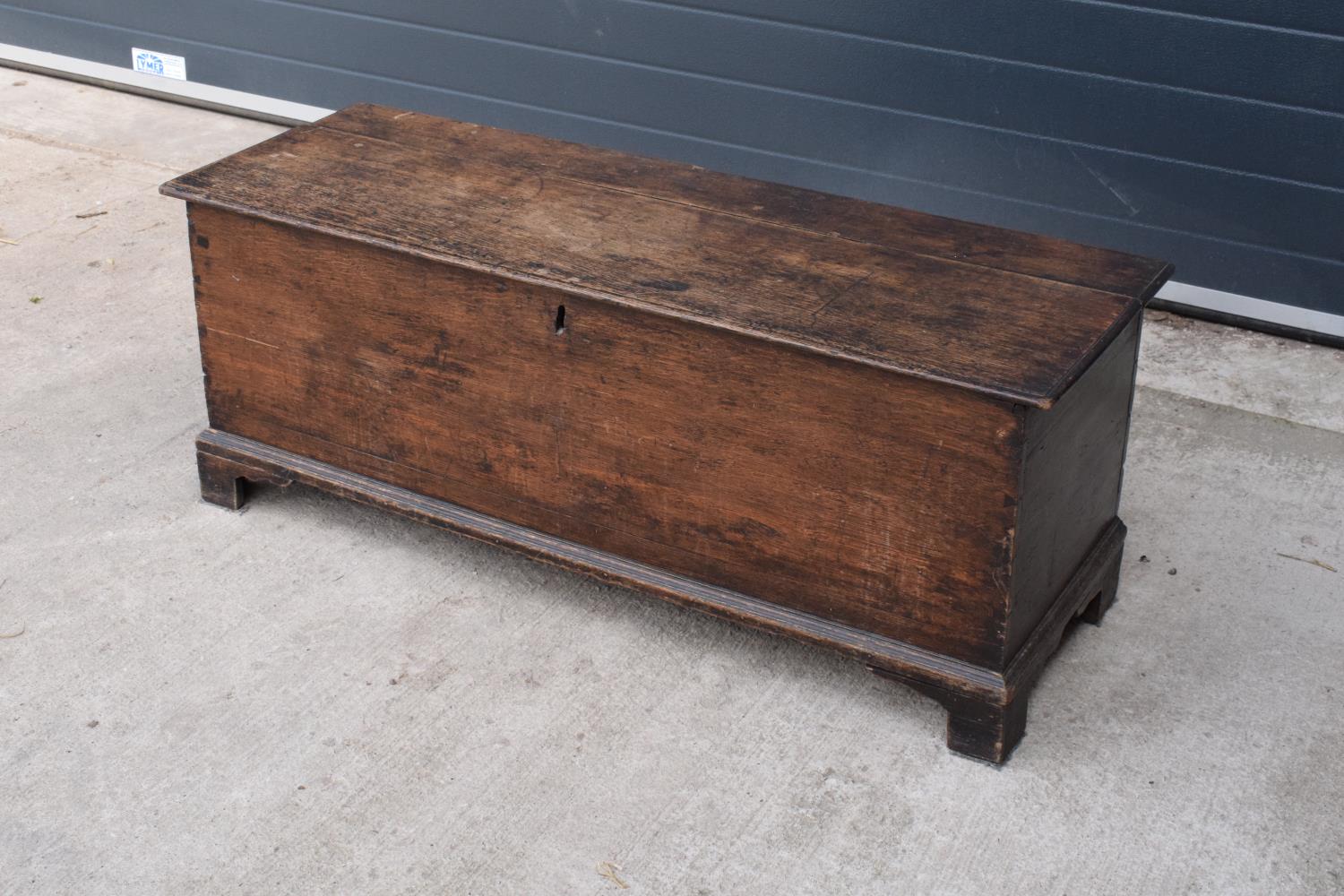 An early 19th century oak chest/ blanket box with a lift up lid. 121 x 44 x 47cm. In good