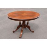 Late 19th century Victorian walnut veneered table with tilt top movement. In good condition with