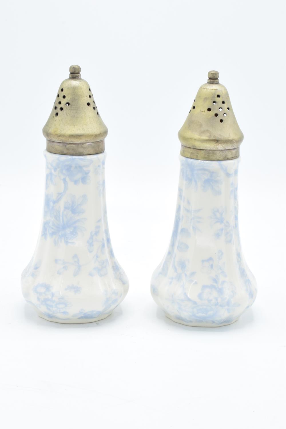 A pair of conical sugar shakers by Lord Nelson Ware in a blue chintz design (2). In good condition