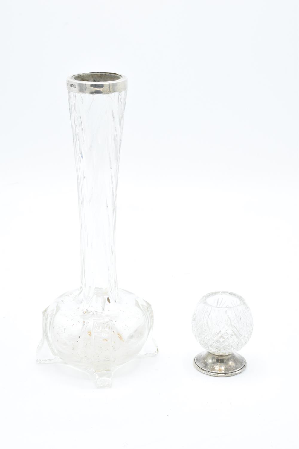 A silver-rimmed glass vase together with a glass cocktail stick holder with a silver base (2).