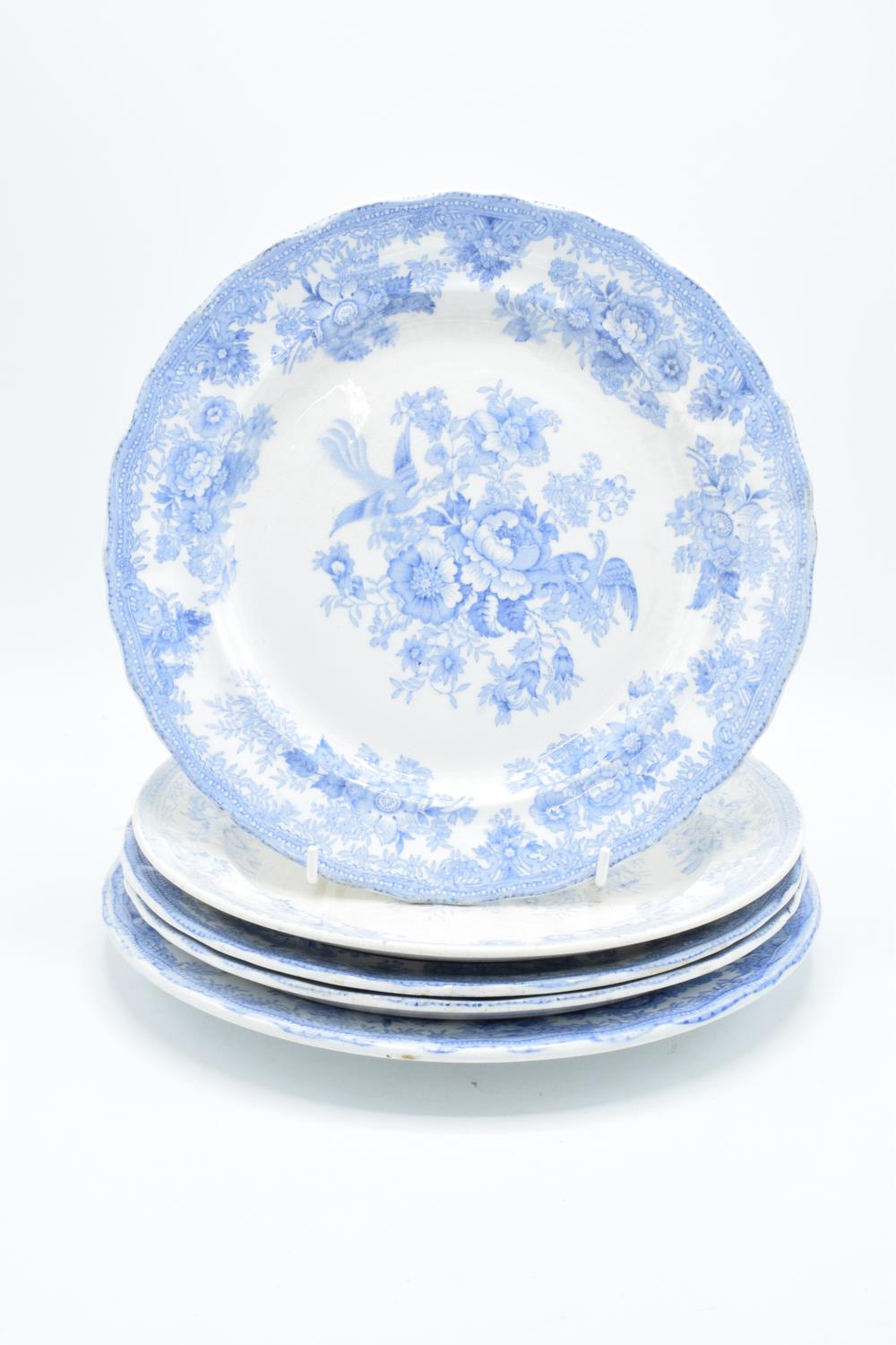 A collection of 19th century blue and white dinner plates in the Asiatic Pheasant design to