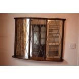 A 20th century wooden mirror with Tudor style/ diamond shaped design. 95 x 74cm. In good condition.