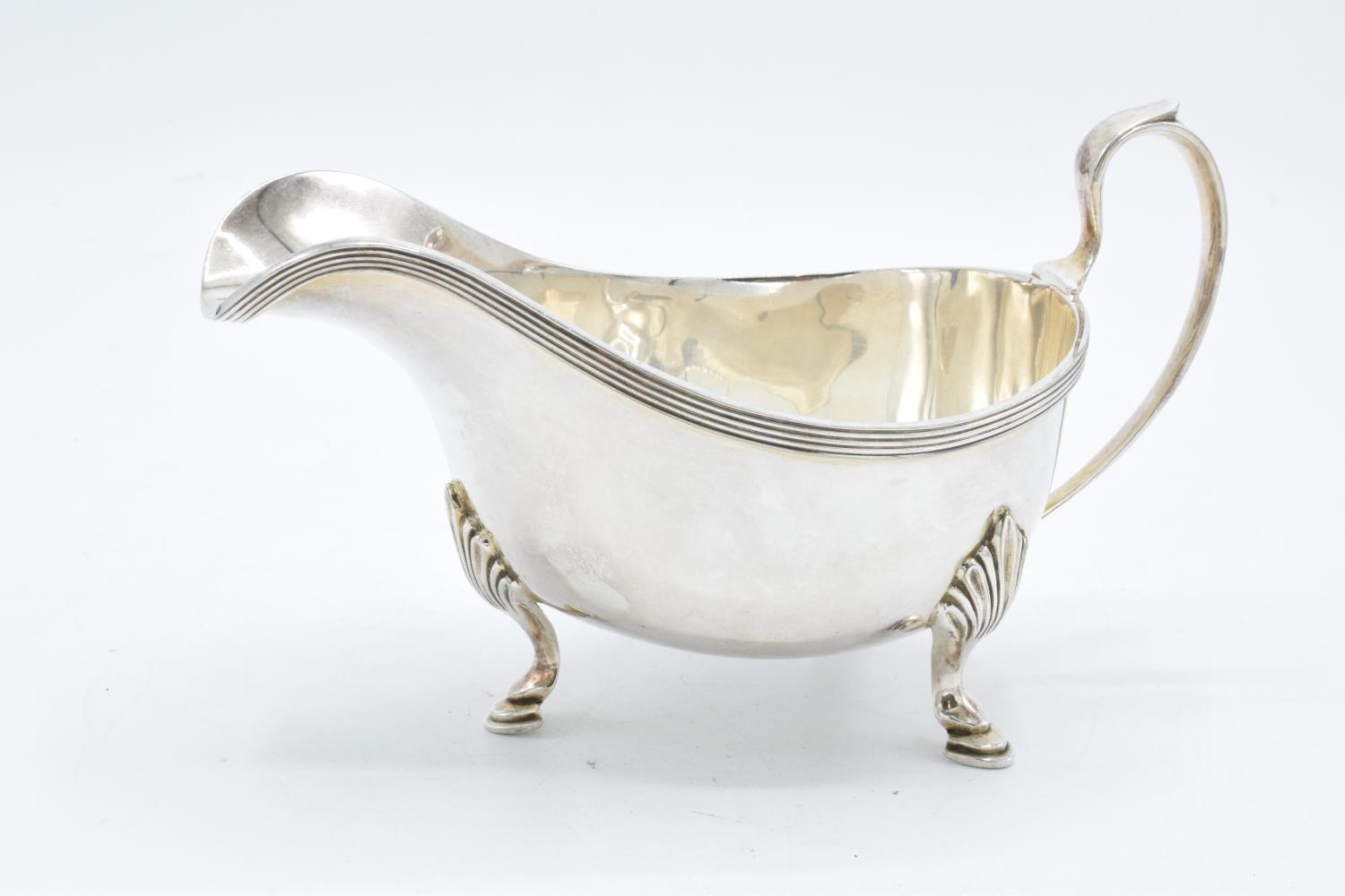 A quality silver plate gravy boat. Some age related wear and tear.