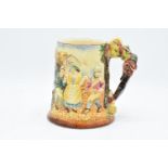 An embossed pottery musical tankard in The Floral Dance design, assumed to be Royal Winton/