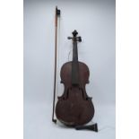 A late 19th/ early 20th century violin and associated bow with the following label on the inside 'E.