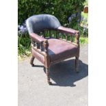 Late Victorian leather tub library chair on caster wheels. 84cm tall. In need of some attention with