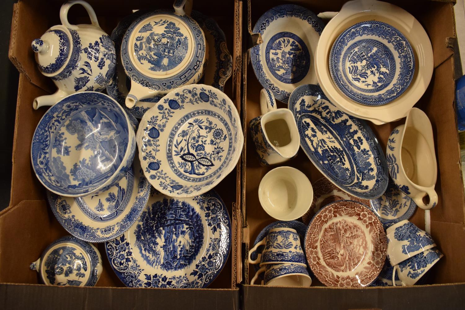 A large collection of 19th and 20th century blue and white pottery to include tea pots, duos,