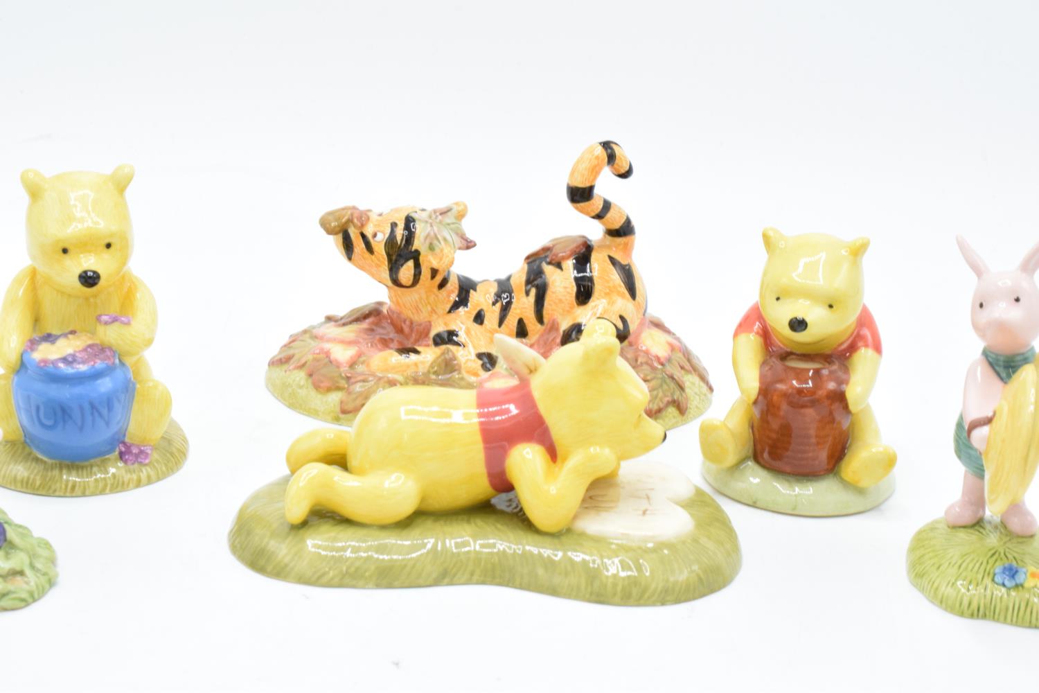 A collection of Royal Doulton Winnie The Pooh figures to include All the flowers are waking up, Love - Image 4 of 7