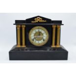A 19th century mantle clock with gilded pillars with an Ansonia Clock Co movement New York USA.