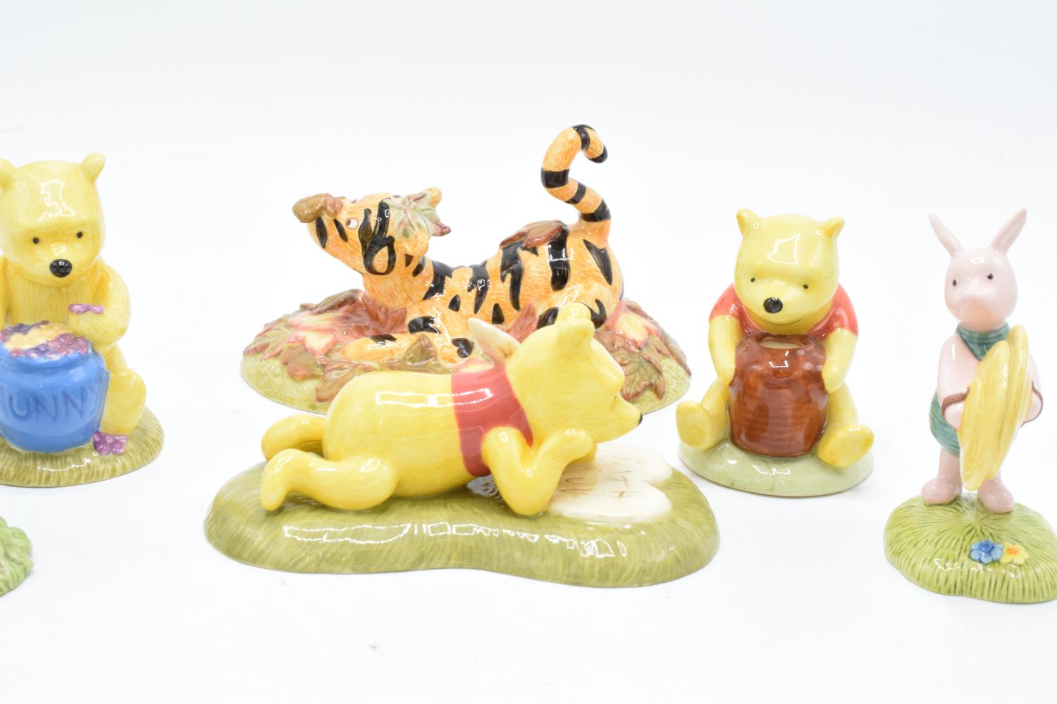 A collection of Royal Doulton Winnie The Pooh figures to include All the flowers are waking up, Love - Image 7 of 7