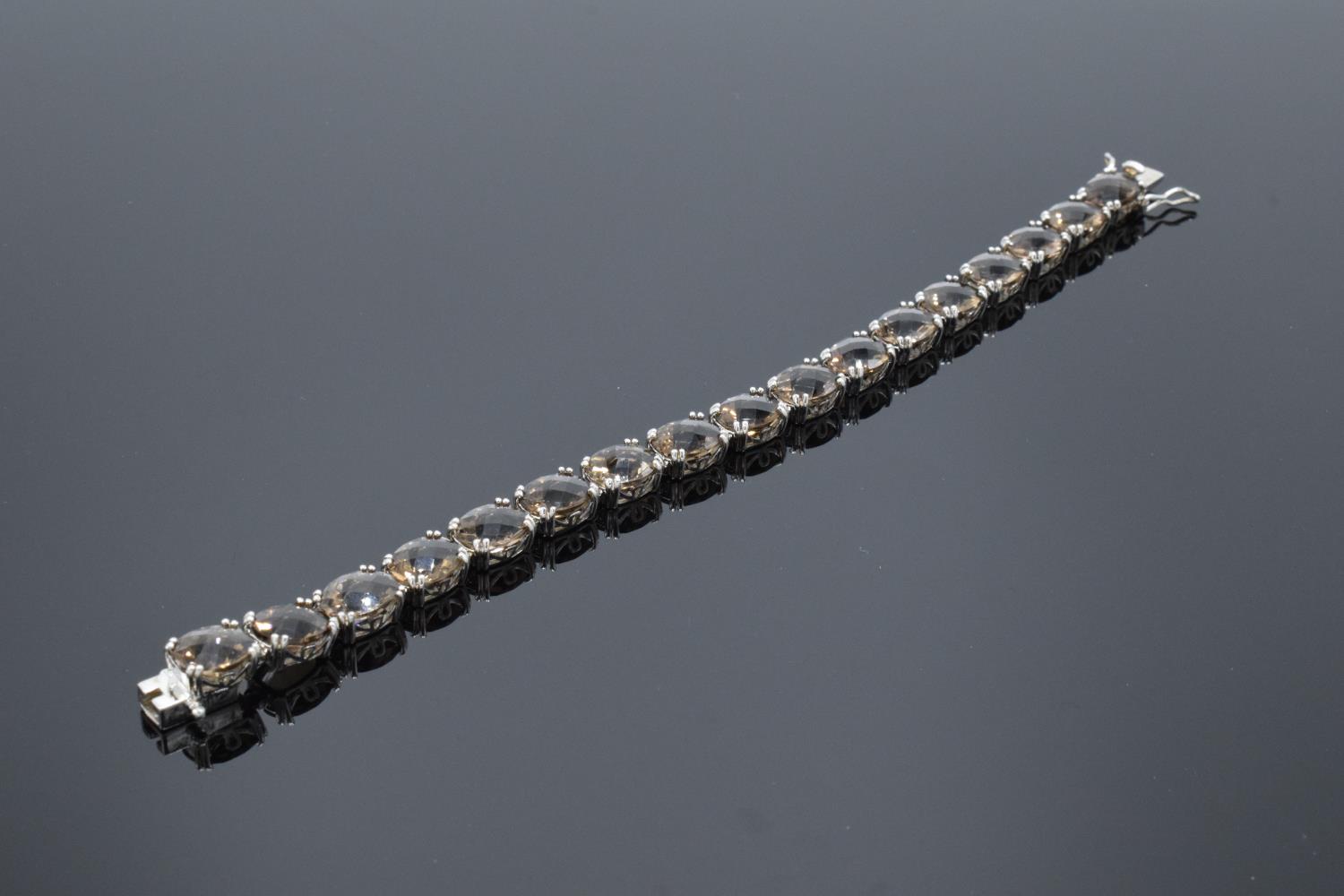 A silver ladies bracelet set with smoky quartz stones, 19.5cm in length. Hallmarked 925 for - Image 2 of 4