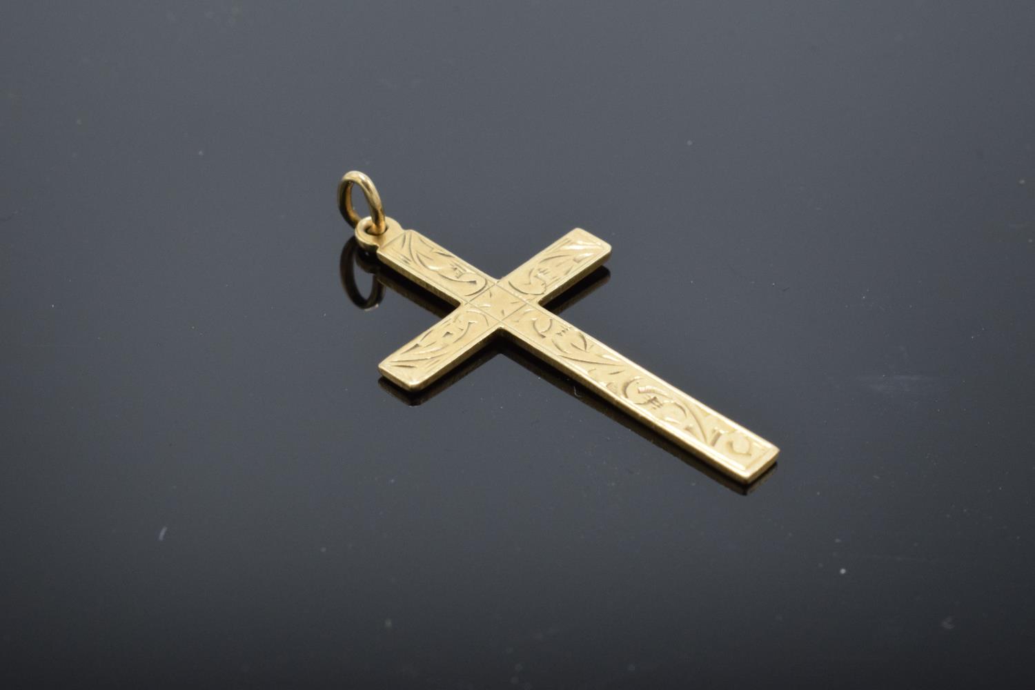 A hallmarked 9ct gold crucifix pendant, 3cm in length. 1.2 grams.