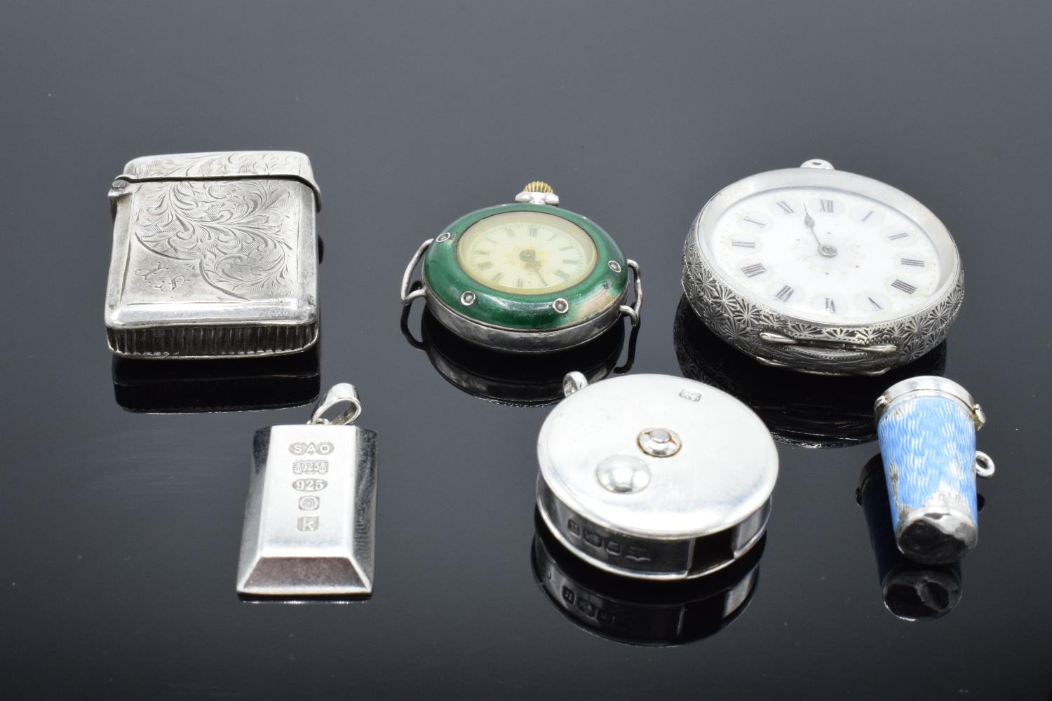 A collection of silver and silver coloured items to include a vesta case (Birmingham 1902) (holes to