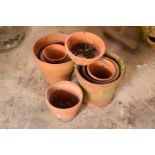 A collection of 20th century terracotta garden pots and planters approx 8-10