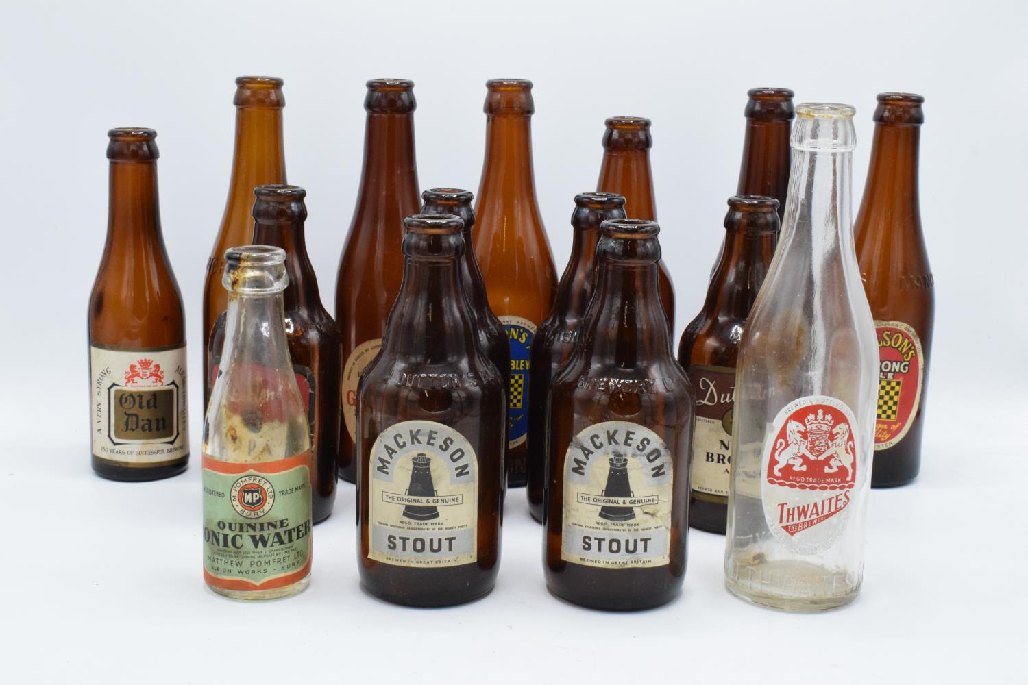 A collection of vintage 20th century beer bottles (mainly brown) to include makes such as Mackeson