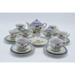 A 20th century dolls tea set decorated with cats to consist of 6 trios, milk jug, teapot, lidded