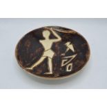 A 20th century studio pottery bowl depicting native scenes with a signature on the reverse which