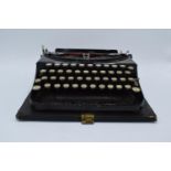 Cased Remington Portable typewriter. Sold as spares/ repairs. Untested.