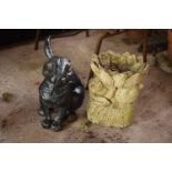 A pair of garden ornaments to include a metal rabbit (missing an ear) and a concrete rabbit