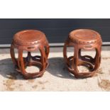 A pair of 20th century Chinese style hardwood barrel/ drum stools. 46cm tall. 41cm at the widest