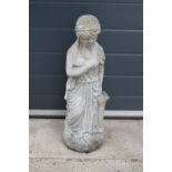 A vintage garden statue in the form of a classical lady in robes, 62cm tall.