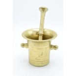 A 20th century solid brass mortar and pestle (2). Very heavy. In good condition. Length of pestle is