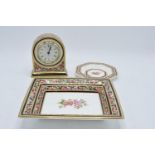 A collection of Wedgwood items in the Clio design to include a clock, a rectangular tray and a pin
