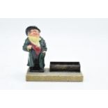 Royal Doulton Dickens figure Tony Weller set on a base with a hallmarked silver trough/ desk tidy.