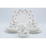 A collection of Tuscan China tea ware in a floral pattern to consist of 12 cups, 11 saucers, 12 side